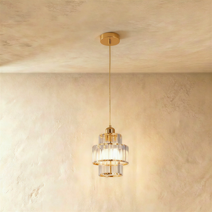 Gold Charagh pendant light by Residence Supply with intricate design and warm illumination, hanging from a ceiling fixture.