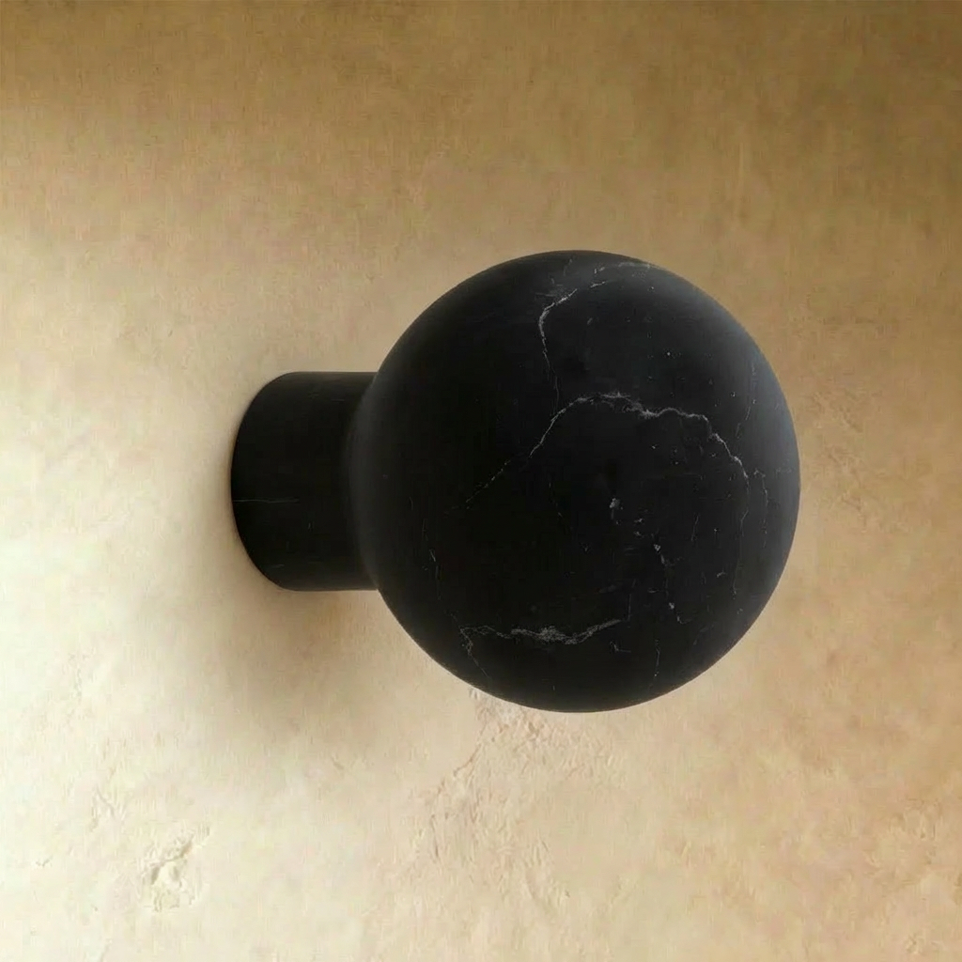 Black marble cabinet knob from Residence Supply's Fon collection, shown on a plain background.
