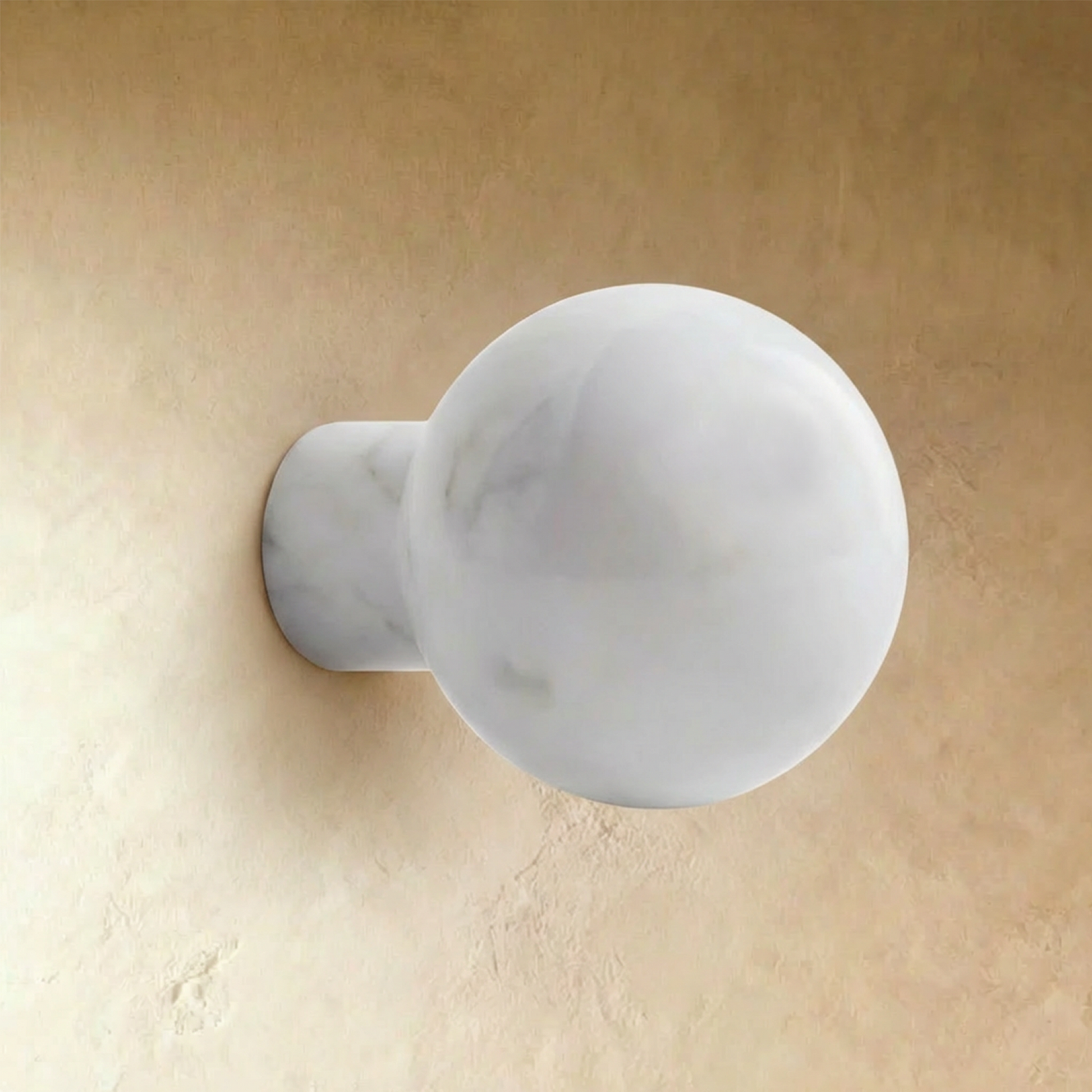 White marble cabinet knob by Residence Supply, stylish round hardware for furniture or cabinetry on a plain background.