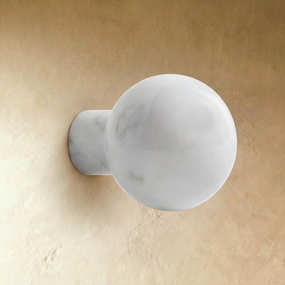 White marble cabinet knob by Residence Supply, stylish round hardware for furniture or cabinetry on a plain background.