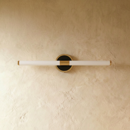 Residence Supply Lacto Wall Lamp mounted on a plain background, showcasing its modern design and sleek white finish.