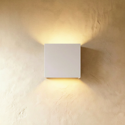 Matte white Lior wall lamp by Residence Supply with sleek, modern design mounted on a wall for stylish lighting.