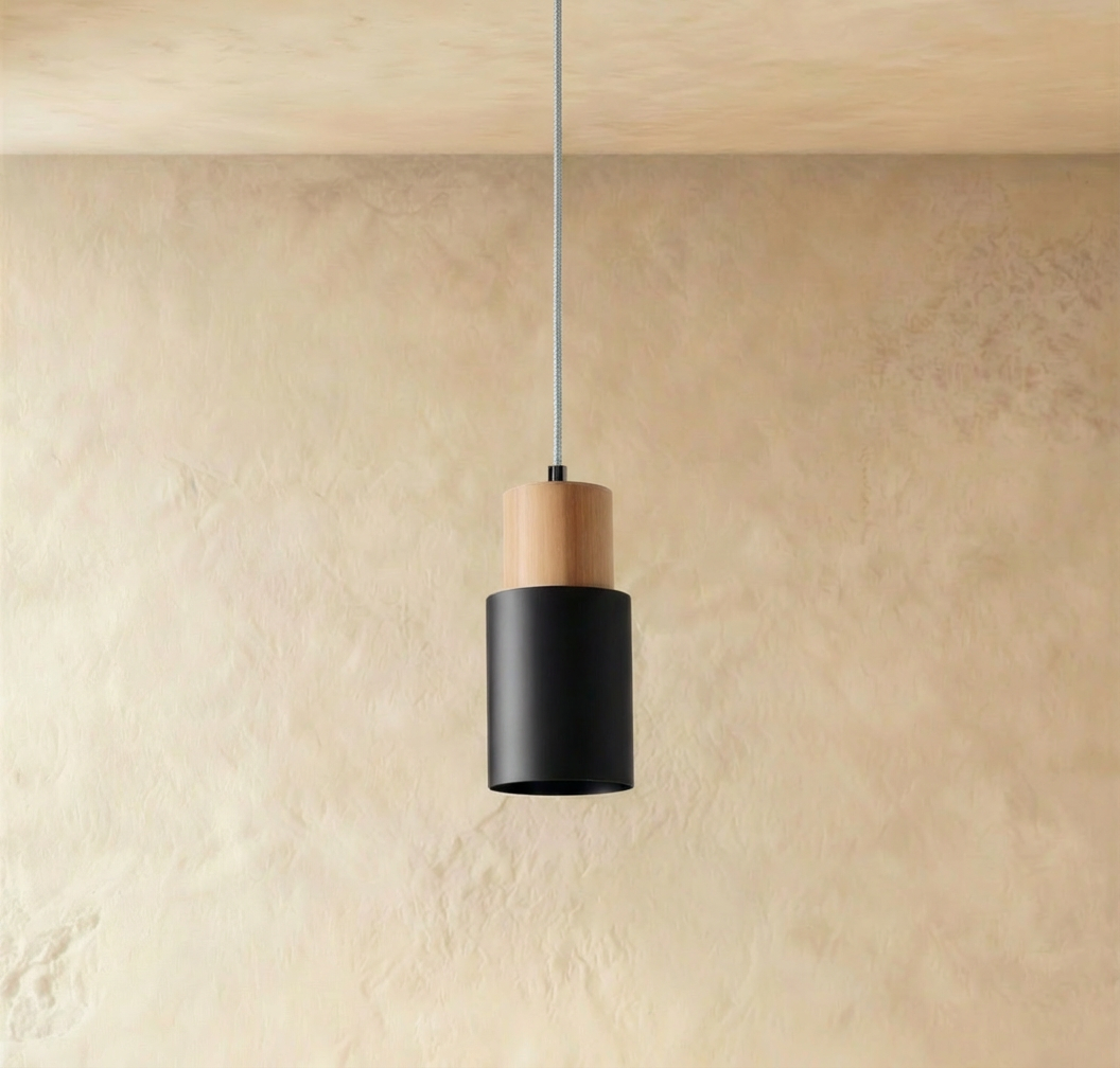 Black Nouveau pendant light by Residence Supply hanging from ceiling with a sleek modern design.