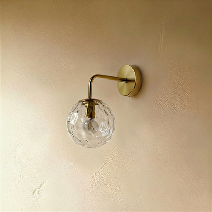 Black Sfera wall lamp by Residence Supply mounted on a plain background, showcasing its sleek, modern design.