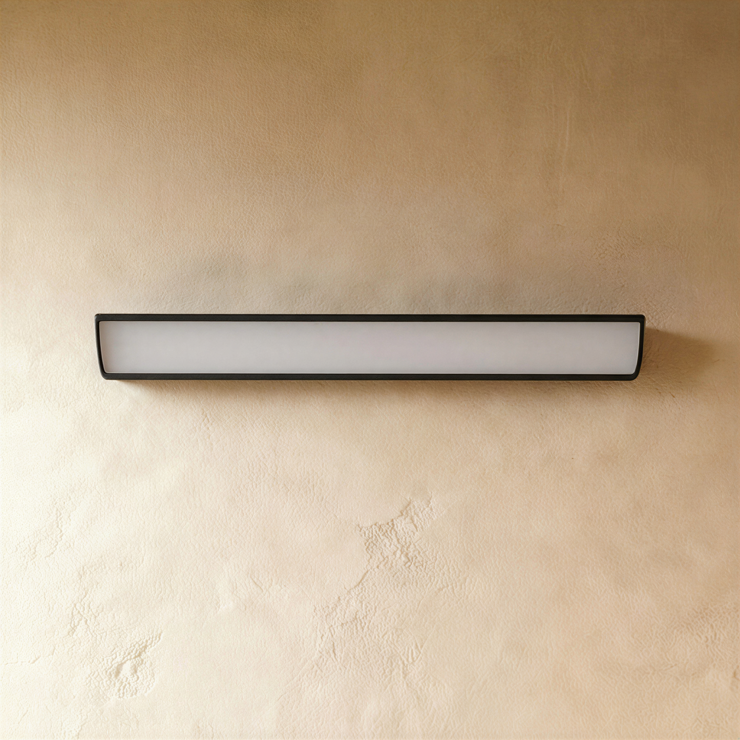 Black Sopdet outdoor wall lamp by Residence Supply mounted on exterior wall with a sleek modern design.