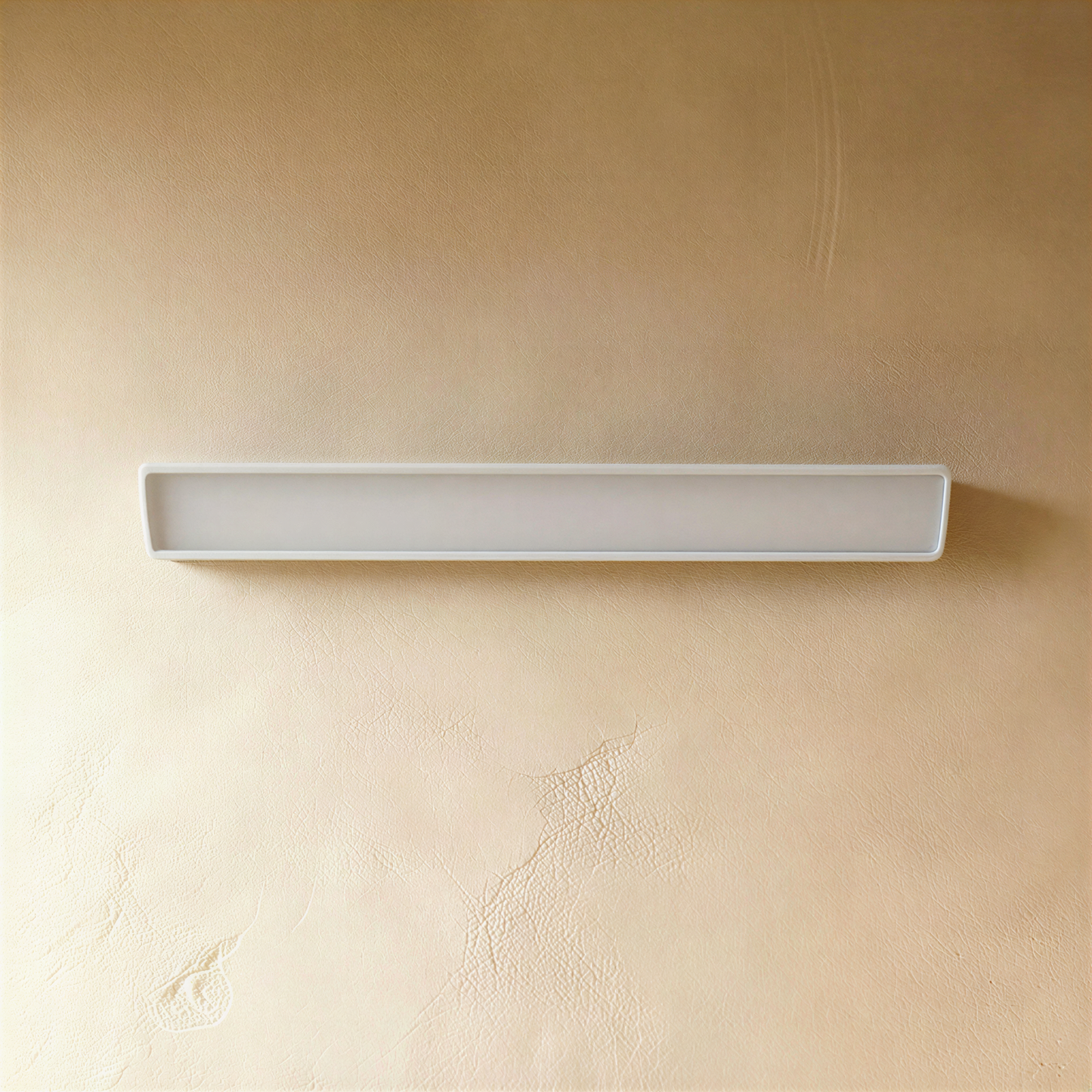 White Sopdet outdoor wall lamp by Residence Supply, featuring a sleek modern design and mounted on an exterior wall.