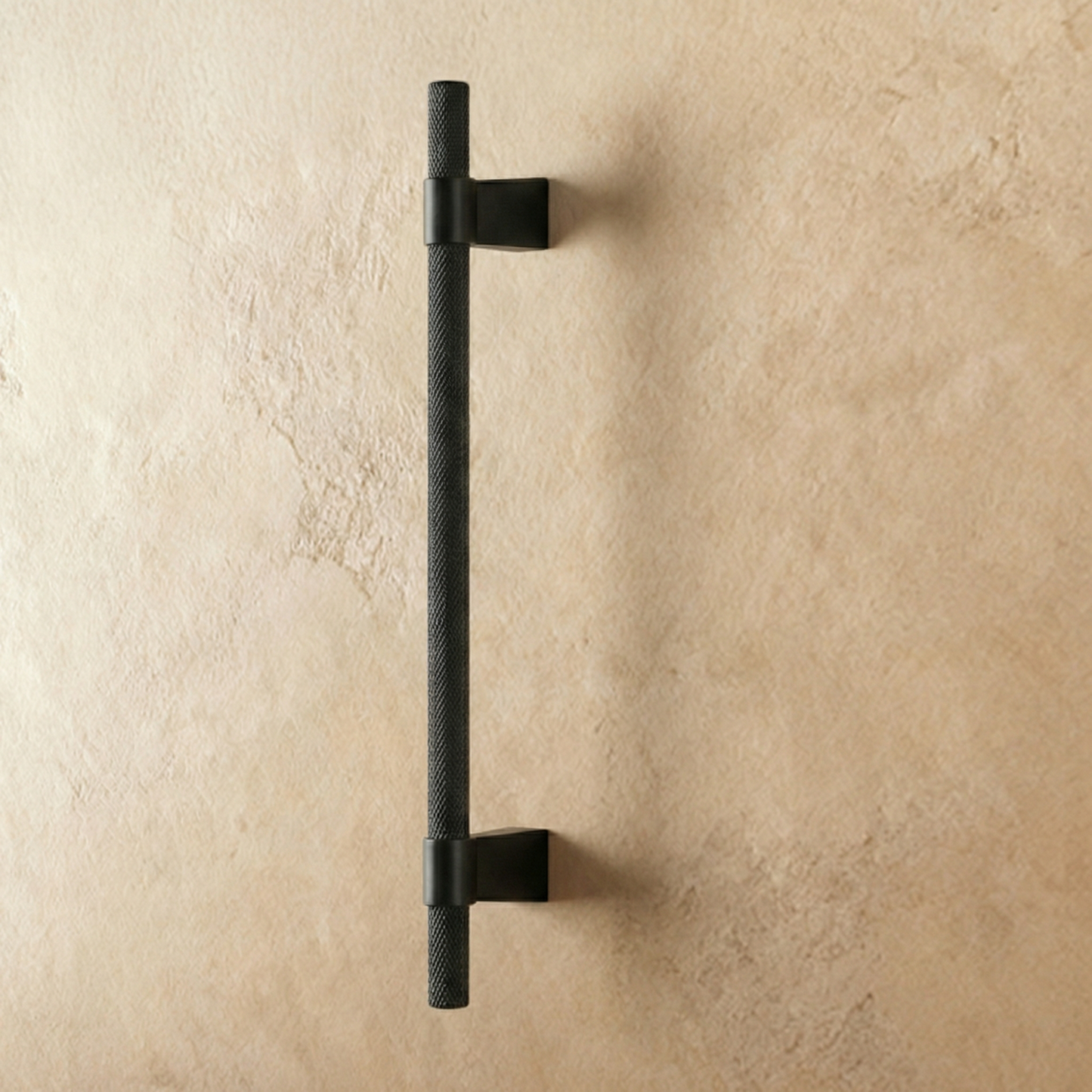 Black Varai Knob and Pull Bar from Residence Supply, cabinet hardware with sleek design on plain background.