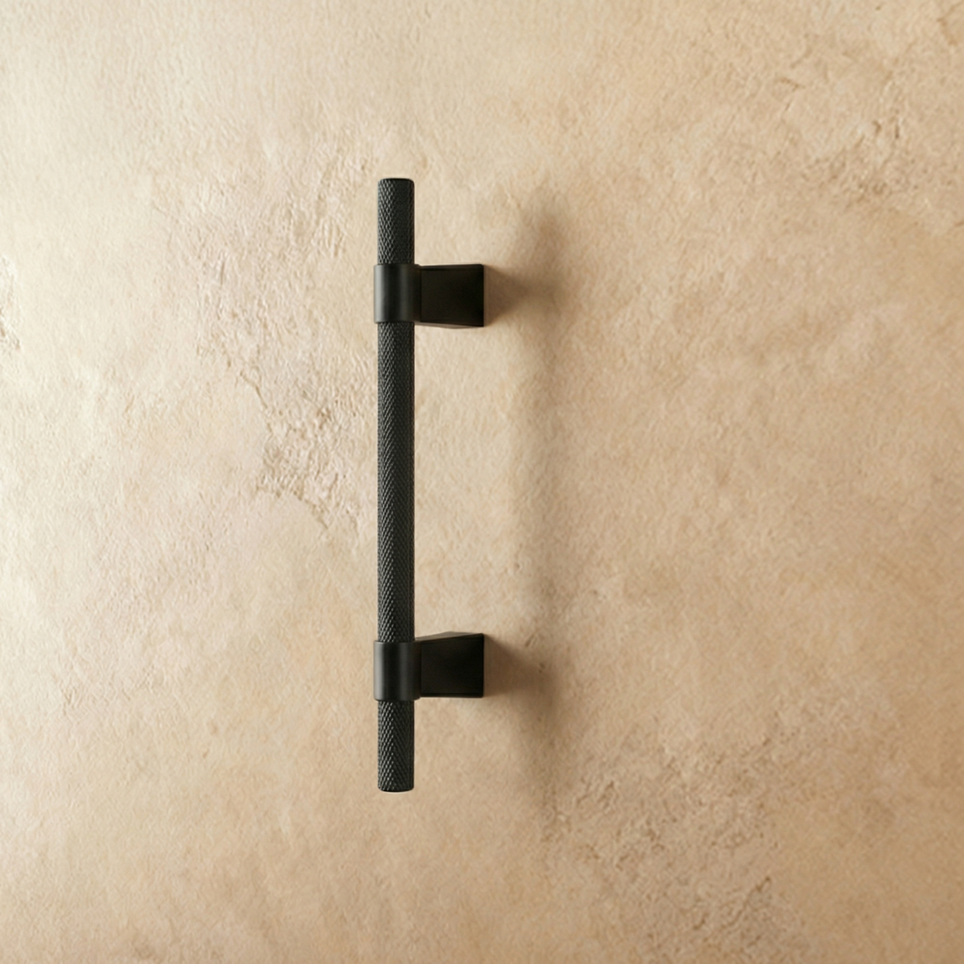 Black Varai Knob and Pull Bar from Residence Supply, stylish cabinet hardware with a sleek design on a plain background.