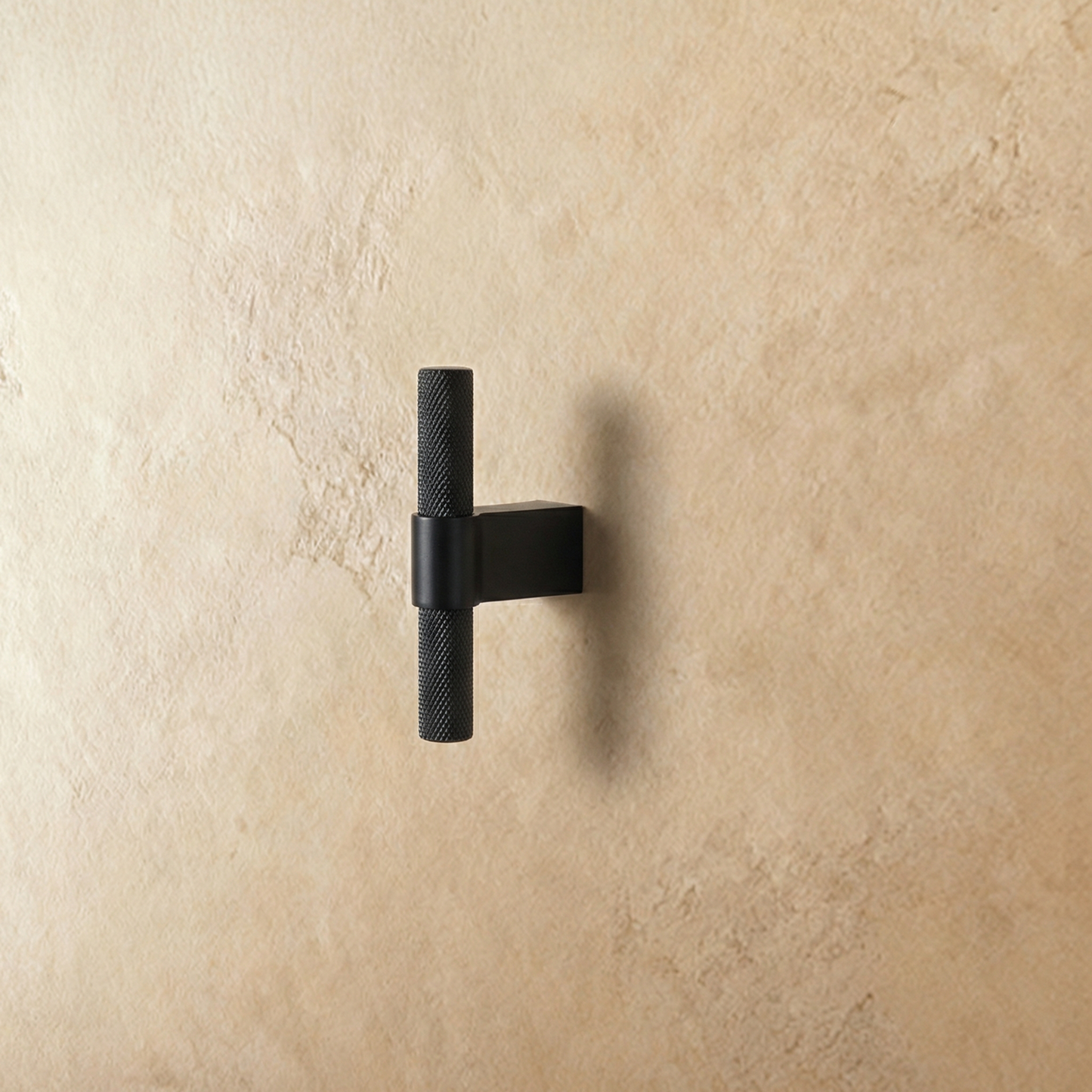 Black Varai knob and pull bar from Residence Supply, 6cm cabinet hardware with sleek, modern design on plain background.