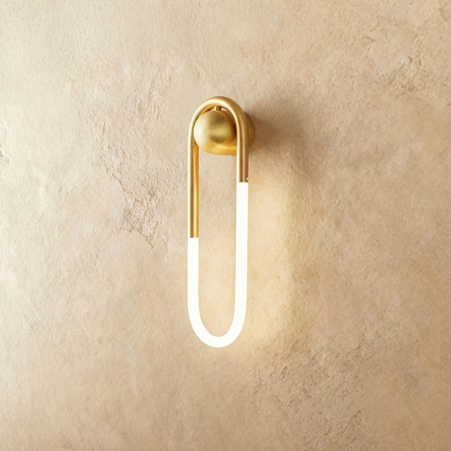 Bronze Zenn Wall Lamp by Residence Supply mounted on a plain background, showcasing its sleek design and 9W light fixture.