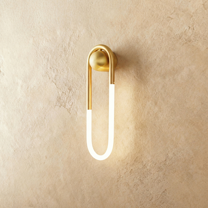 Bronze Zenn Wall Lamp by Residence Supply mounted on a plain background, showcasing its sleek design and 9W light fixture.