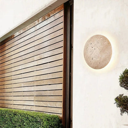 Yellow travertine round wall lamp by Korewolamp featuring a smooth stone finish and modern circular design for elegant lighting.