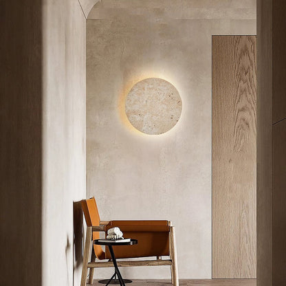 Yellow travertine round wall lamp by Korewolamp, showcasing a textured stone surface and modern wall-mounted design.