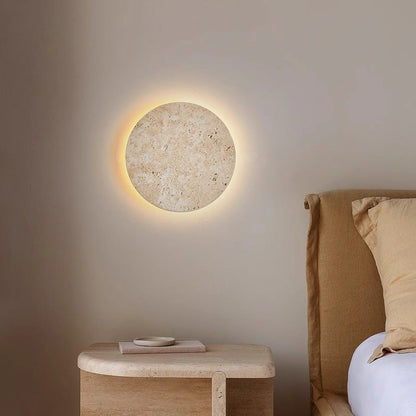 Yellow travertine round wall lamp by Korewolamp, showcasing a smooth stone texture and modern wall-mounted design.