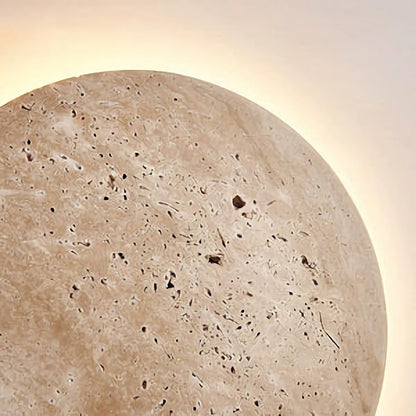 Yellow travertine round wall lamp by Korewolamp, showcasing a smooth stone finish and circular design for interior lighting.