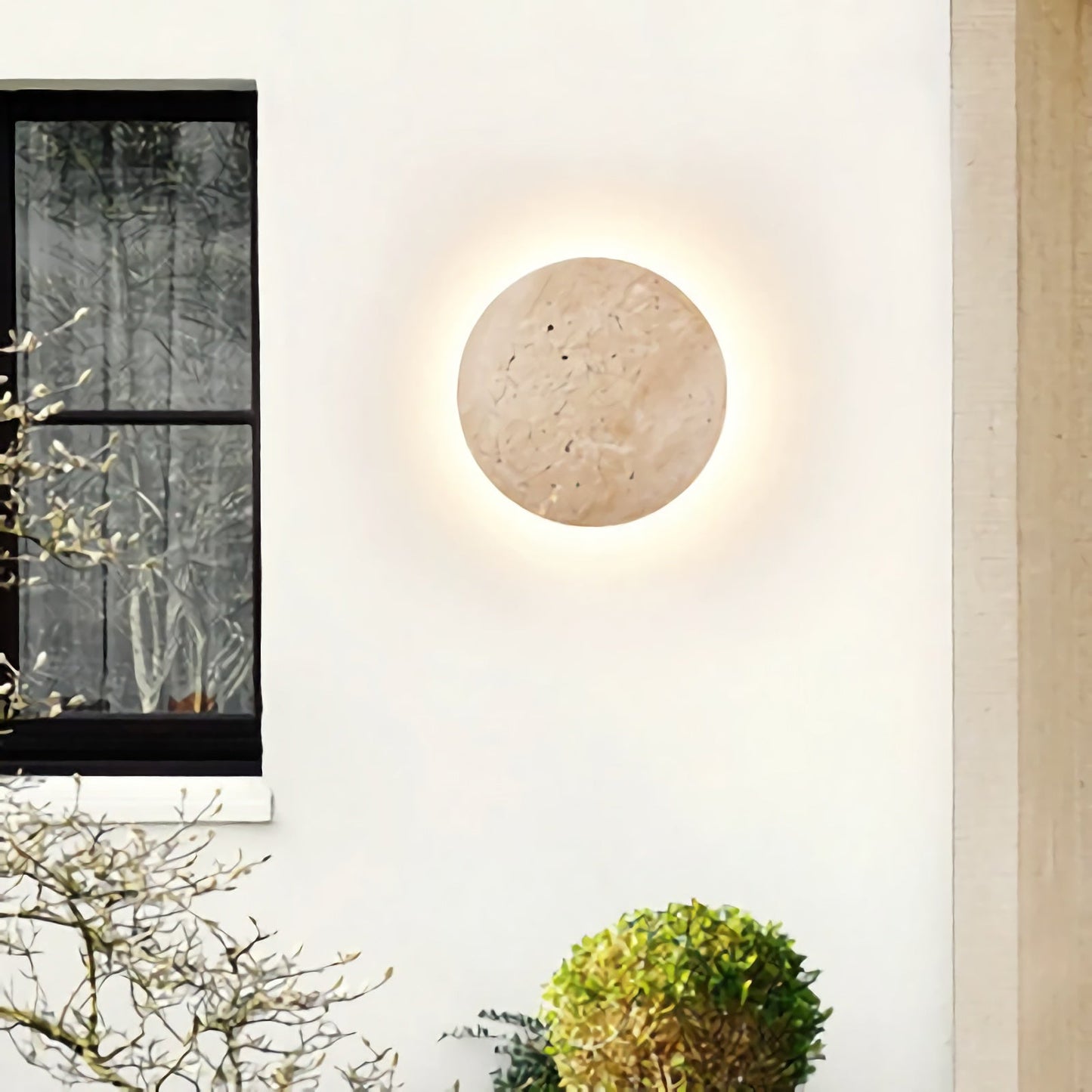 Yellow travertine round wall lamp by Korewolamp, showcasing a smooth stone surface and modern circular wall-mounted design.