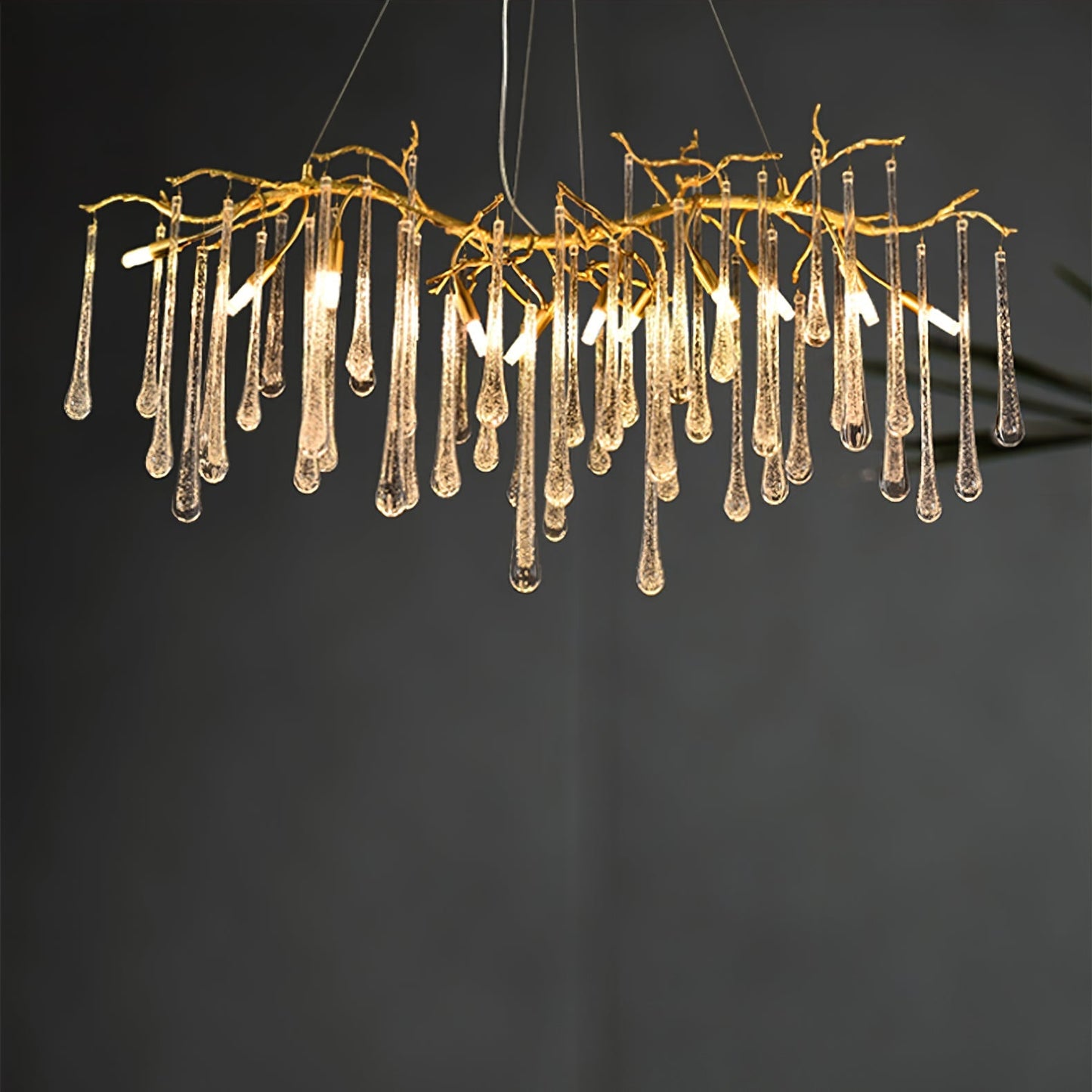 Korewolamp Aqua Makrama chandelier with long teardrop-shaped design hanging from a ceiling fixture.
