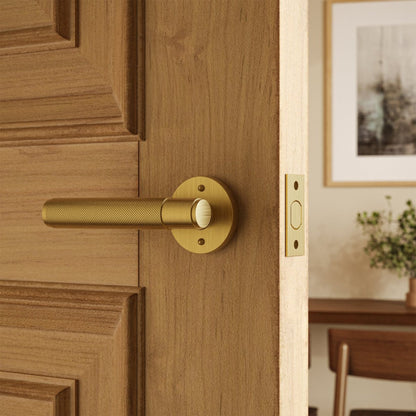 Brass door handle with a polished finish, designed for residential interior doors, from Residence Supply.