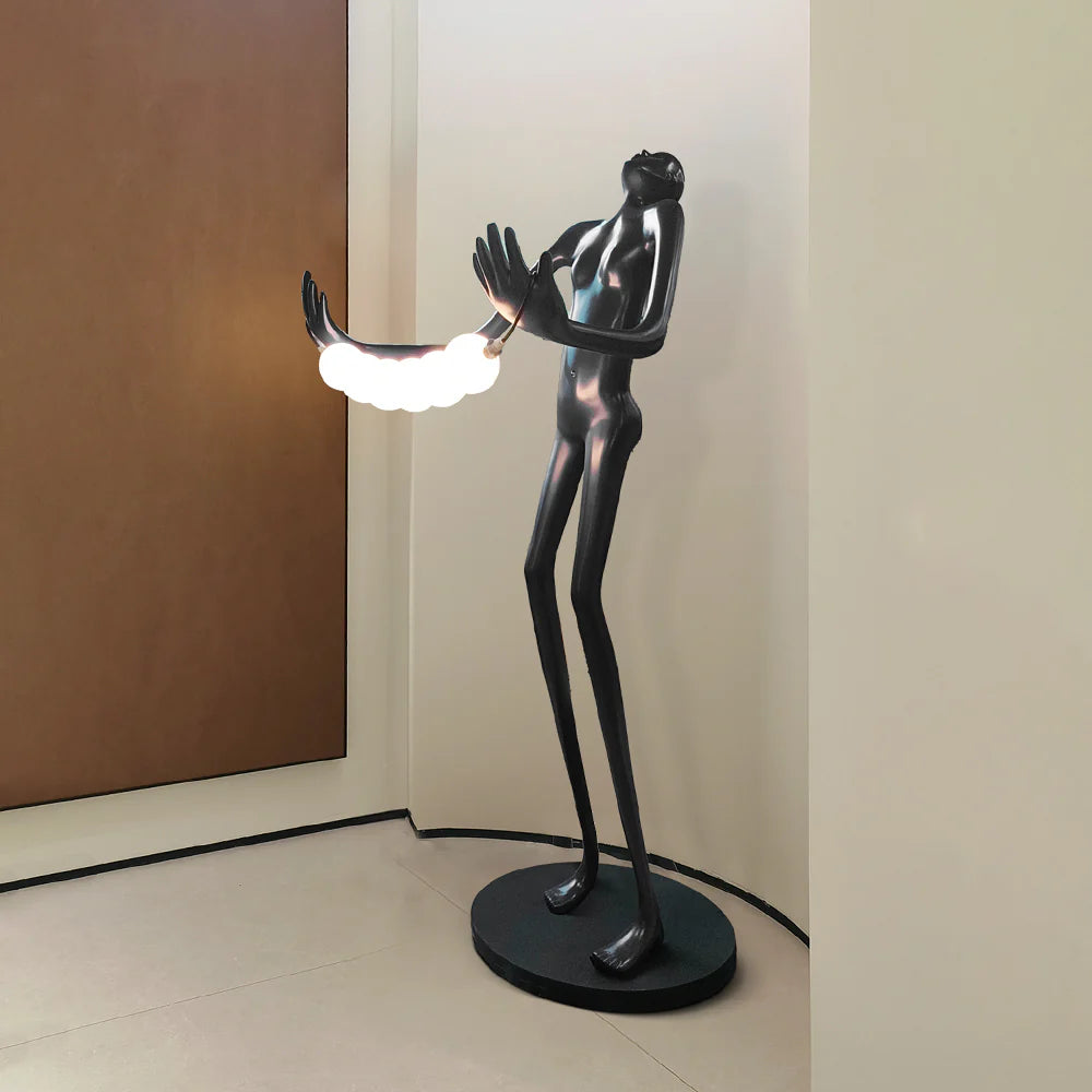 Tilt-head human sculpture floor lamp by korewolamp featuring a modern art-inspired design with a tall, sculptural standing lamp.