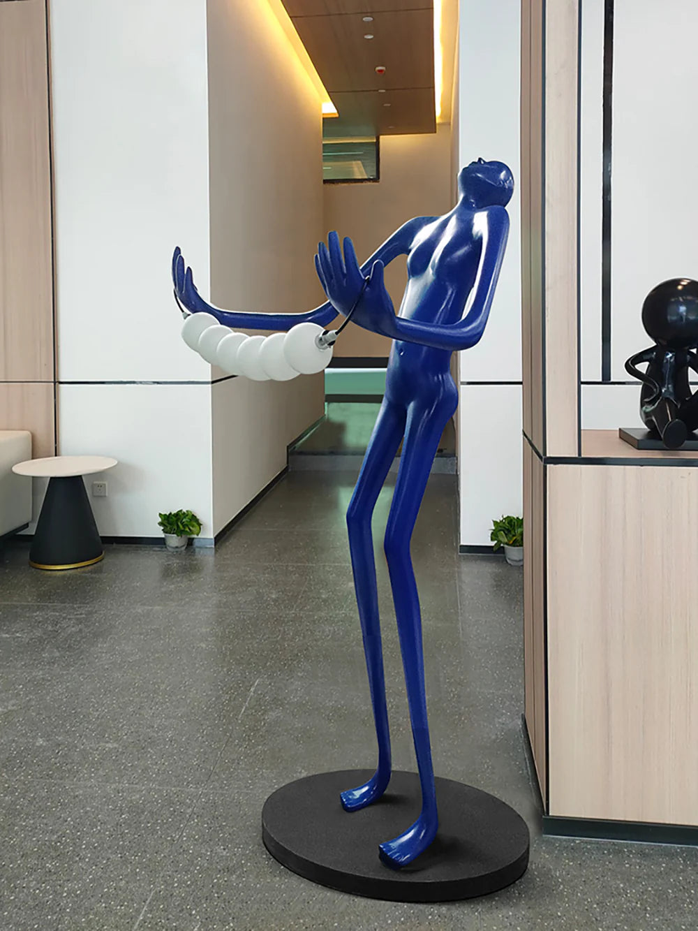 Floor lamp featuring a tilt-head human sculpture design by korewolamp, with a modern artistic style and sleek finish.