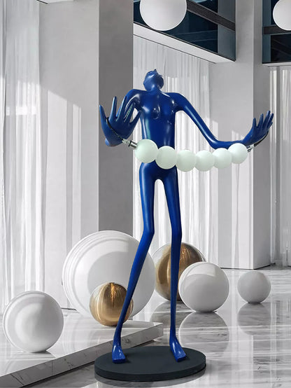 Tilt-head human sculpture floor lamp by korewolamp with a modern, artistic design and adjustable tilt head on a sleek base.