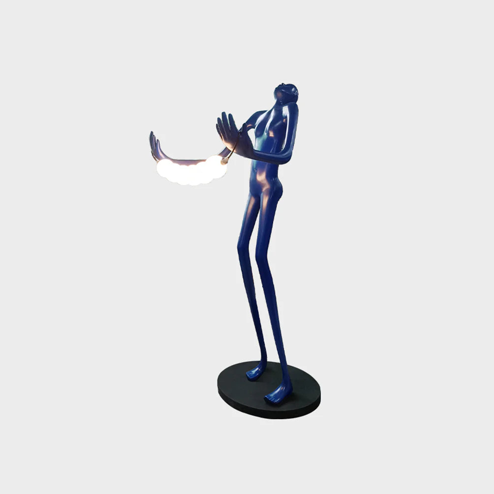 Korewolamp tilt-head human sculpture floor lamp with a modern, artistic design and adjustable head in a living room setting.