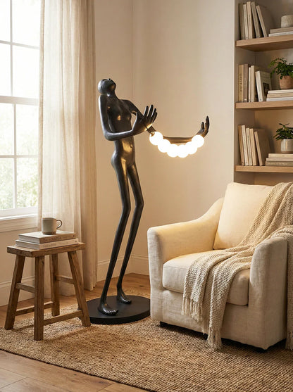 Tilt-head human sculpture floor lamp by Korewolamp featuring a modern art-inspired design and adjustable tilt head for ambient lighting.