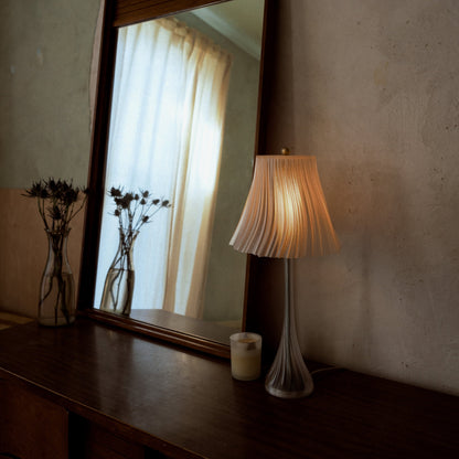 Wooj Design Pleat Lamp with fabric shade and elegant pleated design, perfect for modern living room or bedroom lighting.