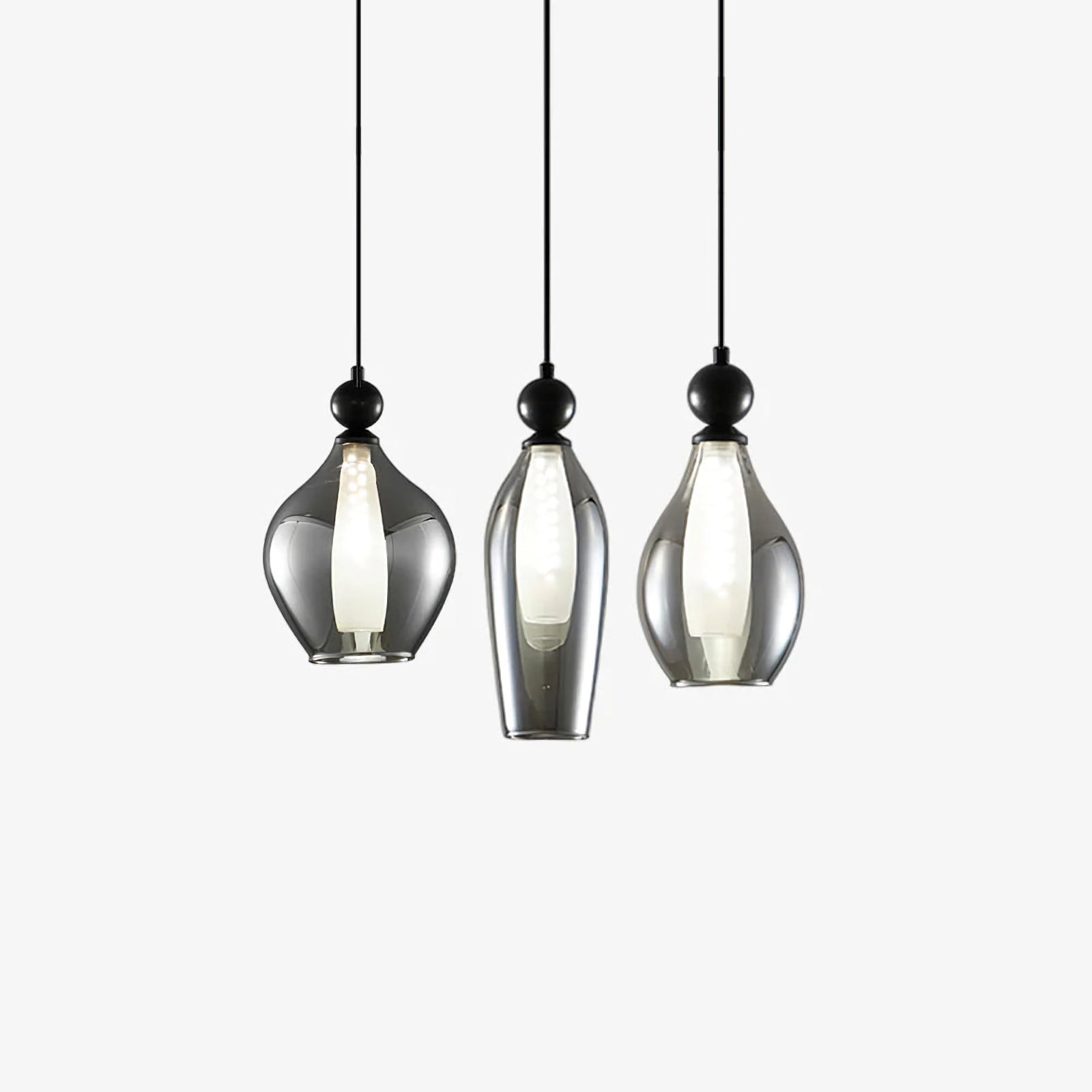 Vista glass pendant light by korewolamp with clear, spherical glass shade hanging from a sleek metal fixture.