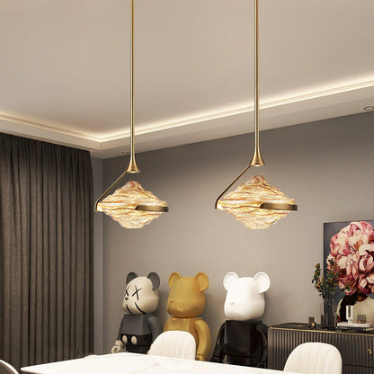 Wavy glass modern pendant light by Korewolamp hanging from ceiling with a sleek, contemporary design and warm illumination.