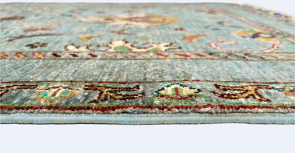 Afghan Khorjin rug by Kirishian Rugs, 2'07" x 4'04", light blue and multicolor traditional design, detailed textile pattern.