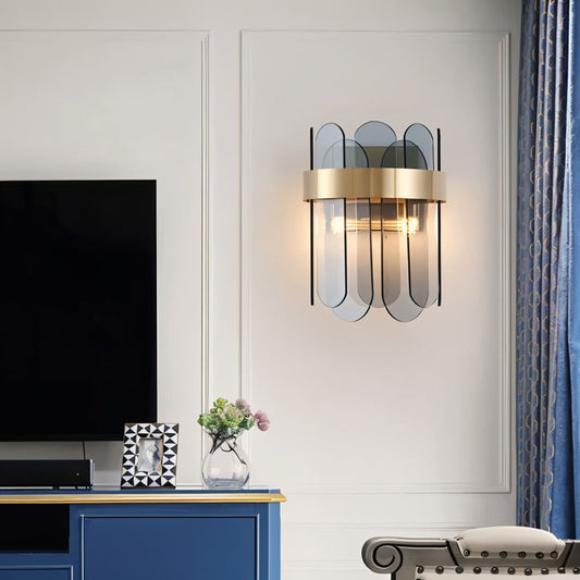 Ailine wall lamp by Residence Supply featuring a sleek modern design with a curved metal arm and a cylindrical shade on a wall.