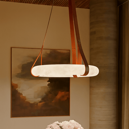 Aktis Alabaster Pendant Light by Residence Supply hanging from ceiling, with smooth alabaster glass shade and modern design.