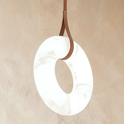 Aktis Alabaster Pendant Light by Residence Supply featuring a smooth alabaster shade hanging from a sleek fixture.
