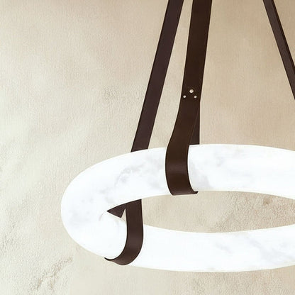 Aktis Alabaster Pendant Light by Residence Supply featuring a smooth alabaster glass shade hanging from a sleek fixture.