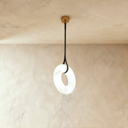 Aktis Alabaster Pendant Light by Residence Supply featuring a smooth alabaster shade and modern design, hanging from a ceiling mount.