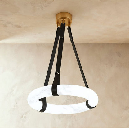 Aktis Alabaster Pendant Light by Residence Supply hanging from ceiling, featuring a smooth alabaster glass shade and modern design.