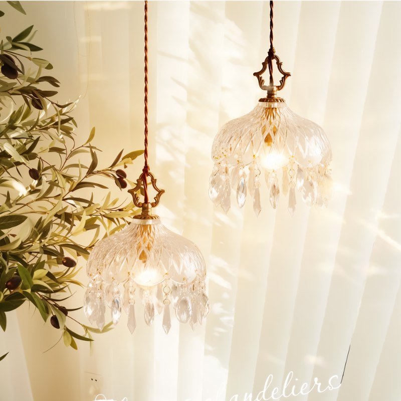 Alshamal glass wall light by Residence Supply mounted on a wall with clear glass shade and modern design.
