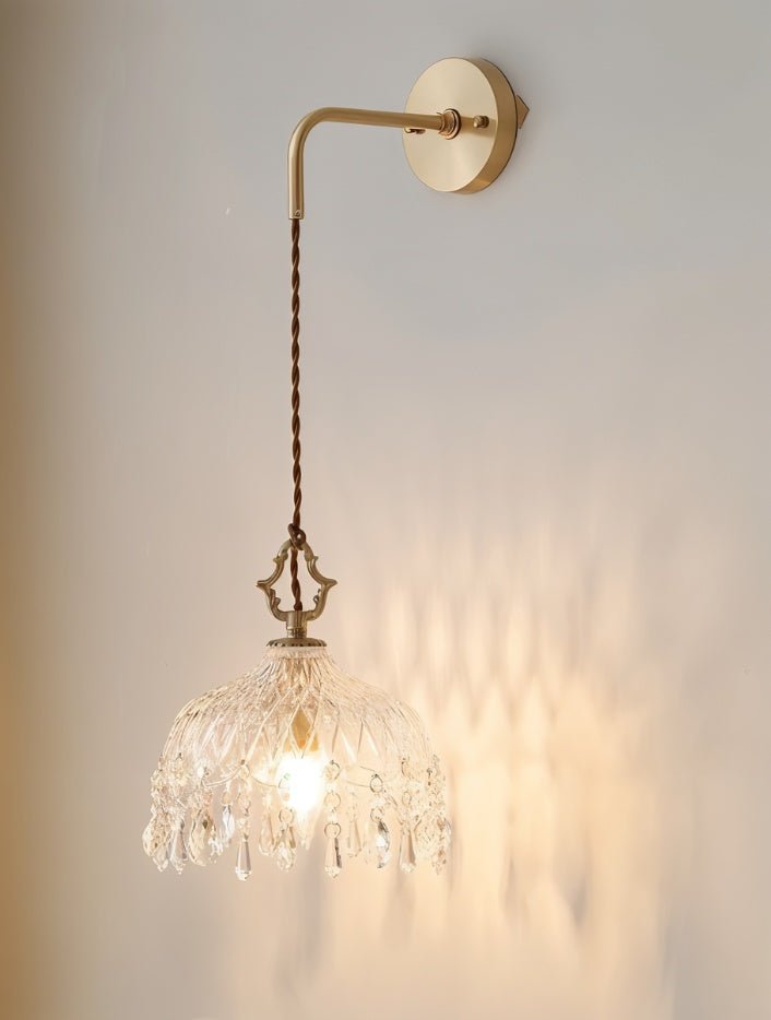 Alshamal glass wall light by Residence Supply mounted on a wall with a clear glass shade and modern design.
