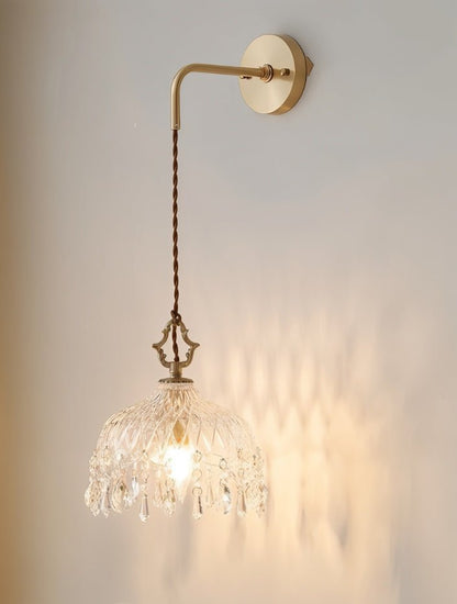 Alshamal glass wall light by Residence Supply mounted on a wall with a clear glass shade and modern design.