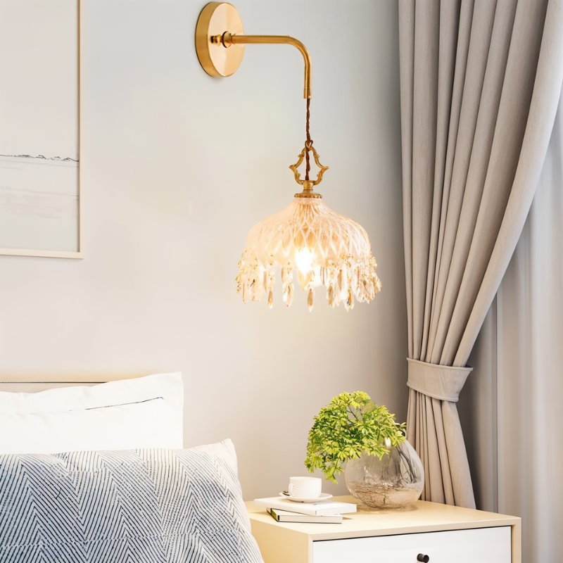 Alshamal glass wall light by Residence Supply mounted on a wall with a clear glass shade and metal fixture.