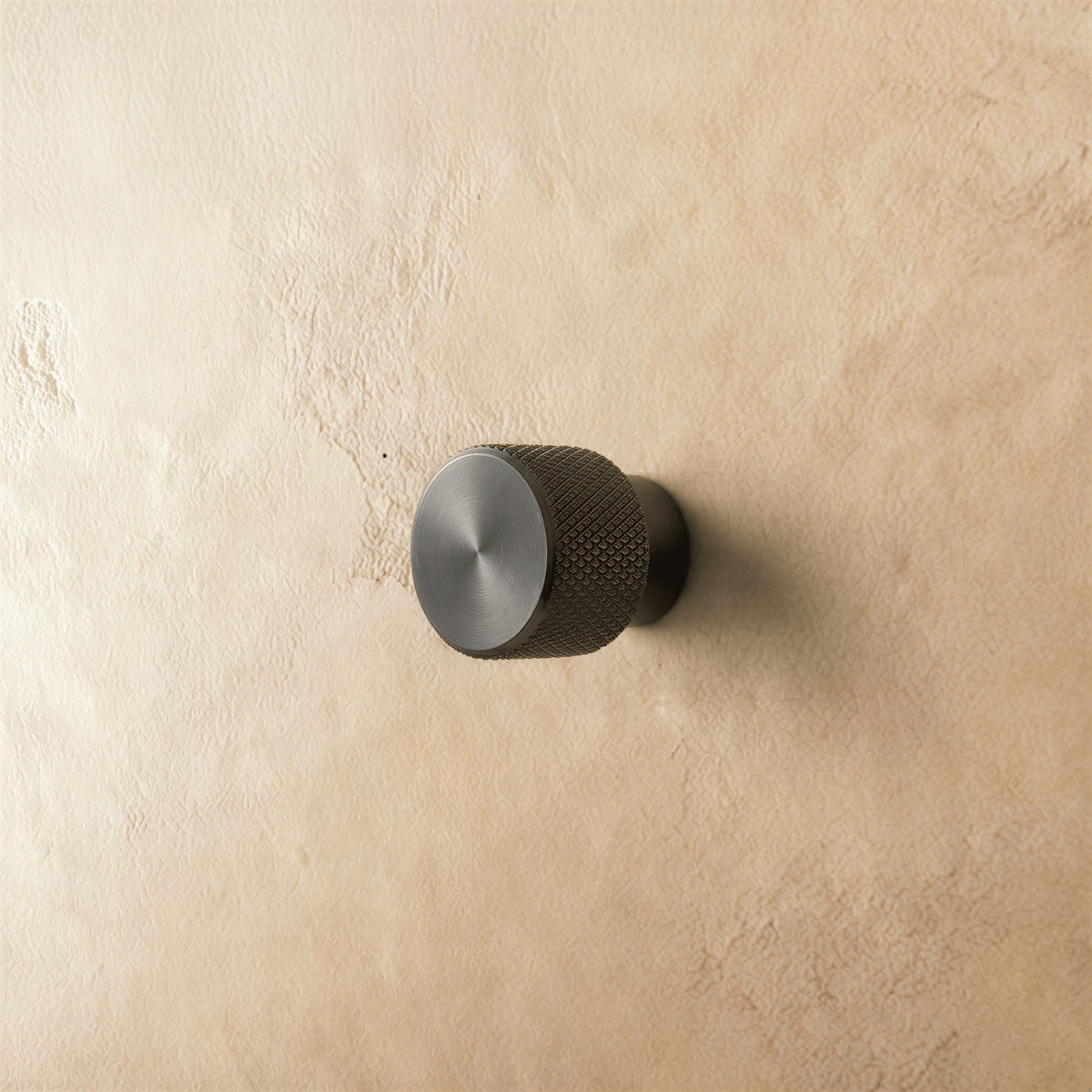 Alyma knob and pull bar in brushed nickel finish, designed for cabinet hardware in a home and garden setting.