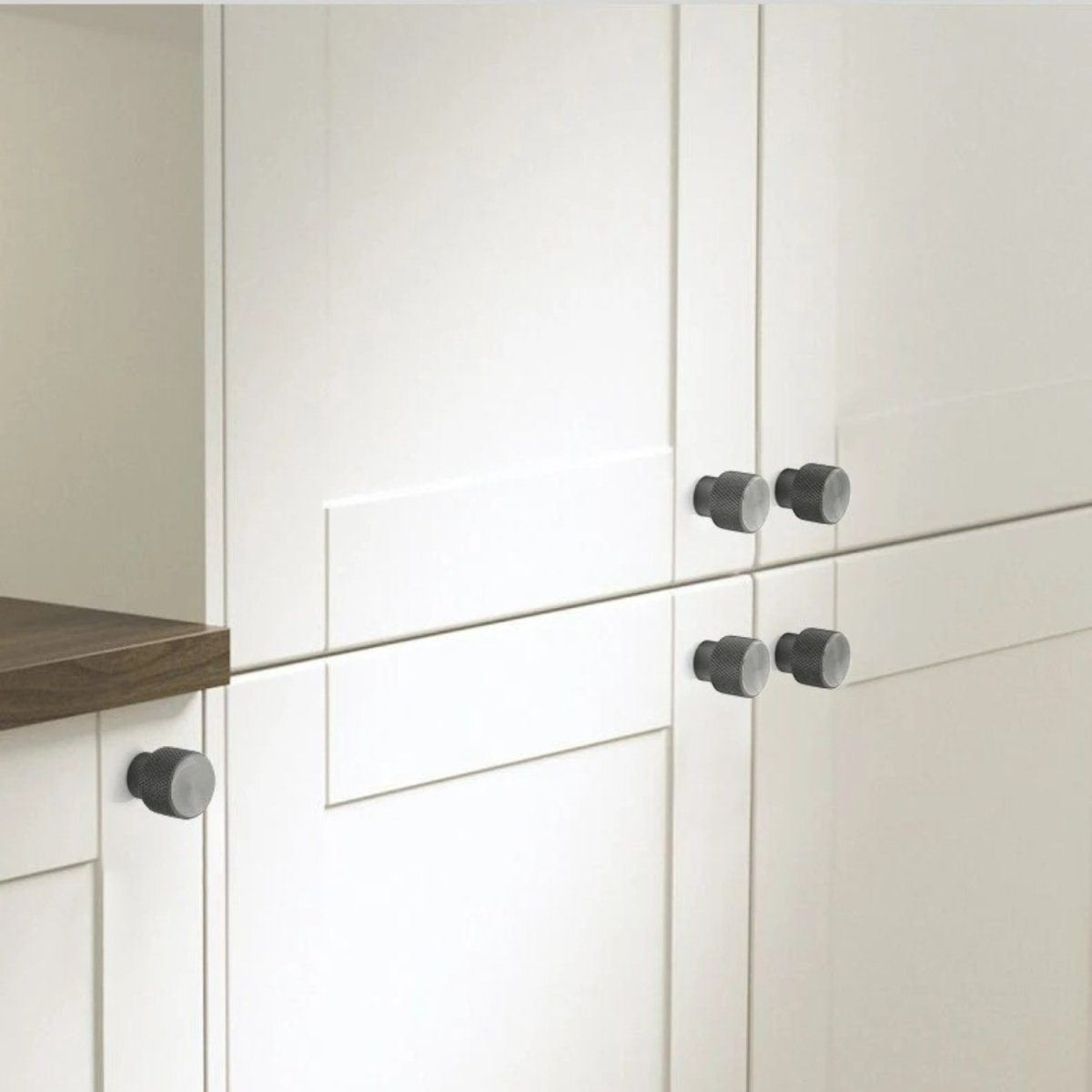 Alyma Knob and Pull Bar from Residence Supply, stylish cabinet hardware with sleek metal finish, mounted on a wooden cabinet.