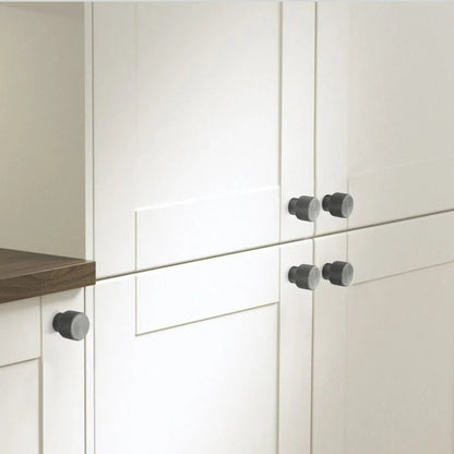 Alyma Knob and Pull Bar from Residence Supply, stylish cabinet hardware with sleek metal finish, mounted on a wooden cabinet.