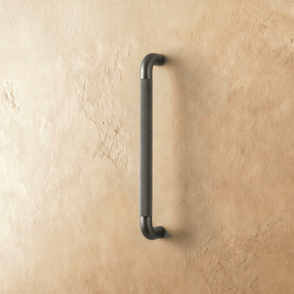 A Alyma knob and pull bar from Residence Supply, featuring sleek metal handles for cabinet hardware in home and garden decor.