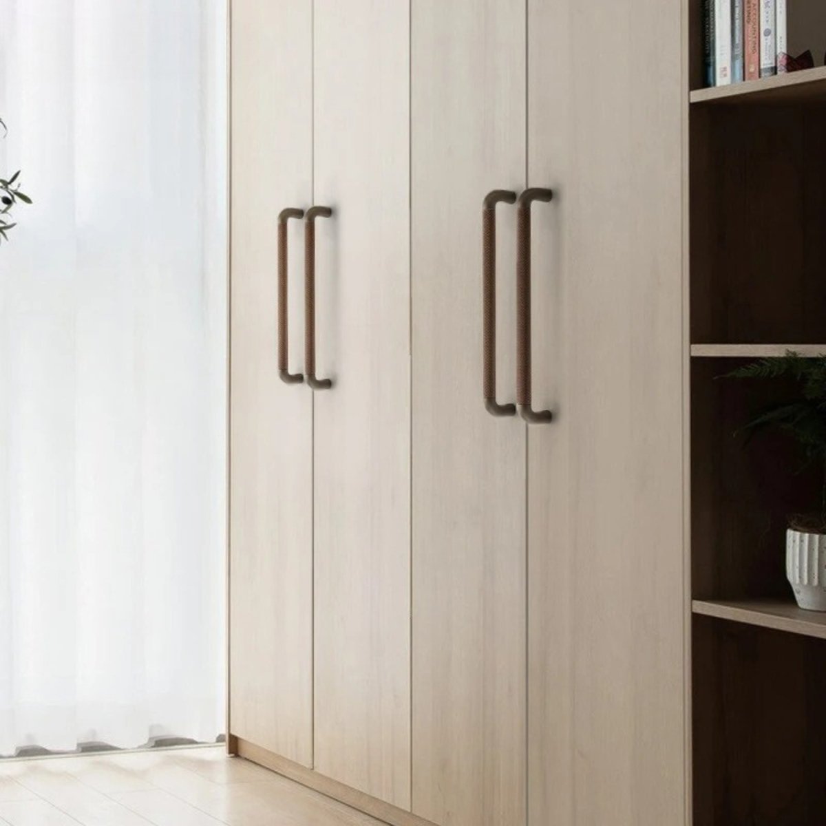 A close-up of the Alyma knob and pull bar from Residence Supply, featuring sleek metal cabinet hardware for home and garden.
