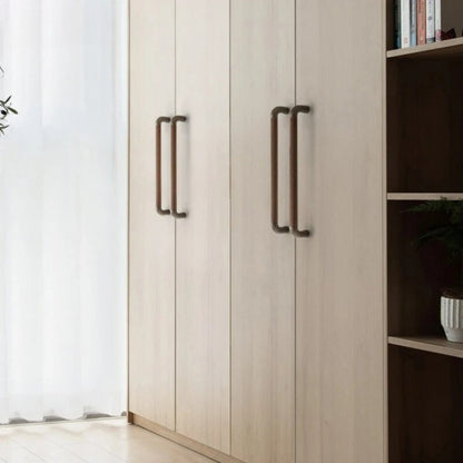 A close-up of the Alyma knob and pull bar from Residence Supply, featuring sleek metal cabinet hardware for home and garden.