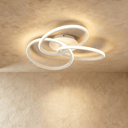 Modern Alyona Ceiling Light by Residence Supply featuring a sleek, circular design with warm LED illumination.