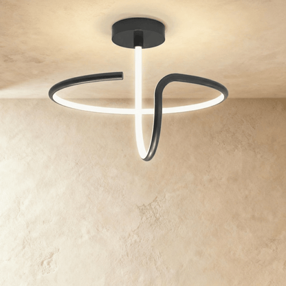 Alyona ceiling light by Residence Supply featuring a modern design with a sleek metal finish and ambient lighting.