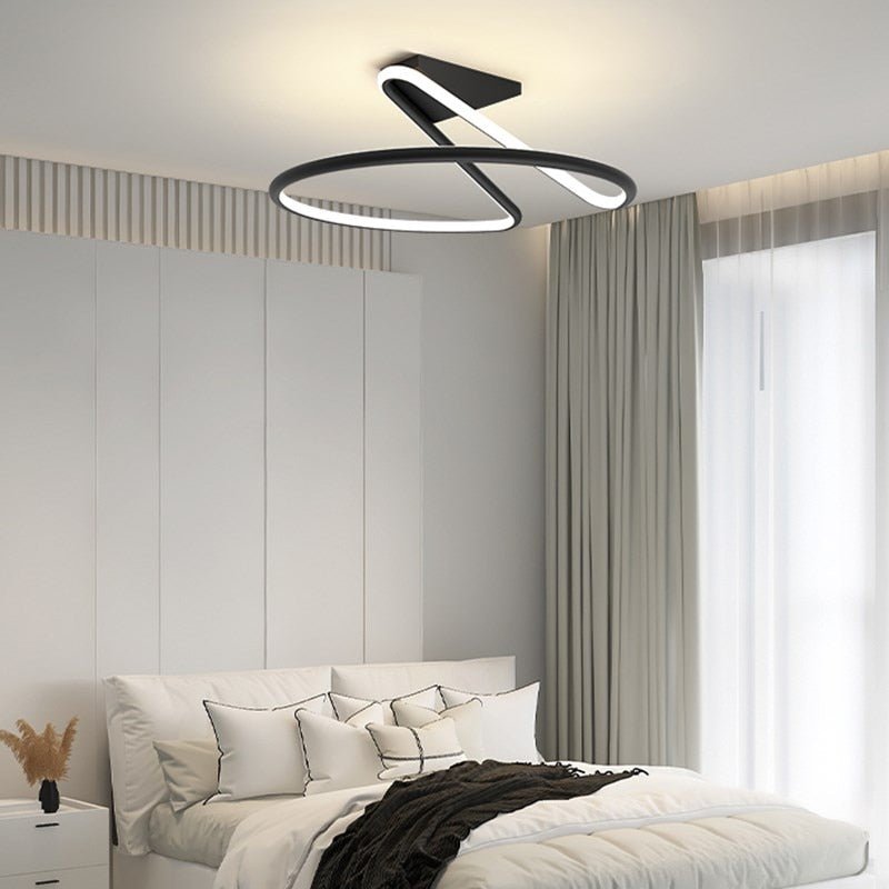 Alyona ceiling light fixture by Residence Supply with a modern design and glass shade, mounted on a ceiling.